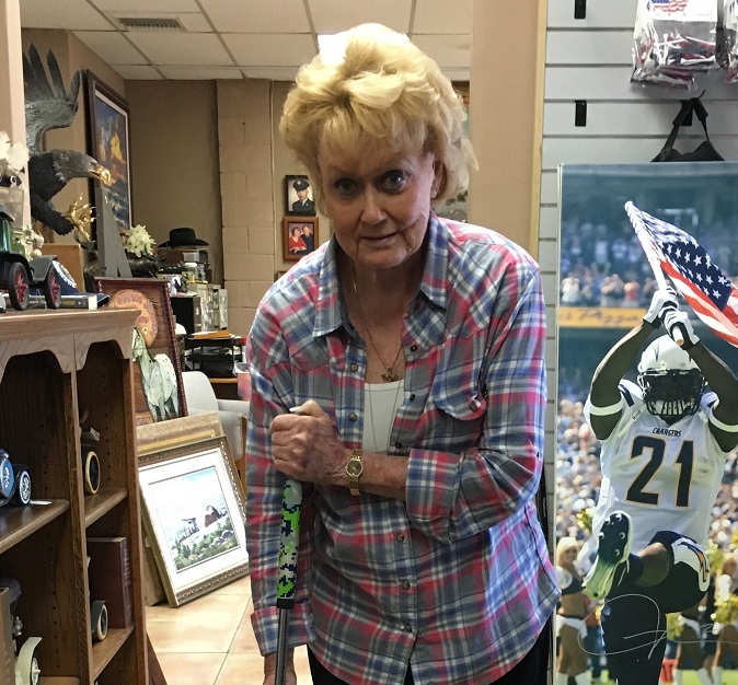 Ms. Bobby P. after purchasing a face-on putter at the USA Golf Masters storefront in El Cajon, California.