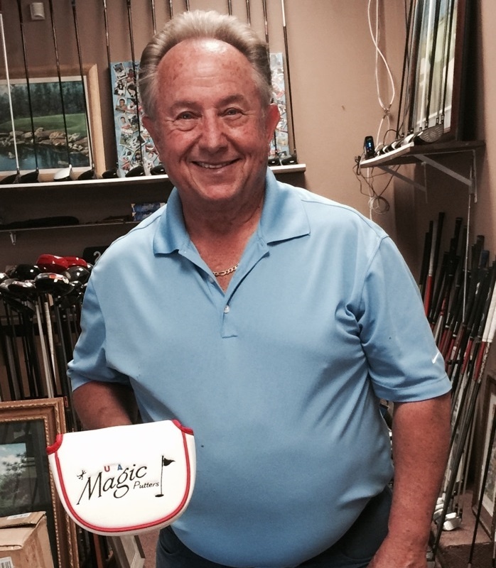 Mr. Benjamin Jones holding the Magic Putter, which is used for side-saddle putting. Various golf clubs in the background.